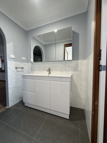 Ashcroft Bathroom Renovation: 3-Way Bathroom Renovation by Jim’s Bathrooms Sydney